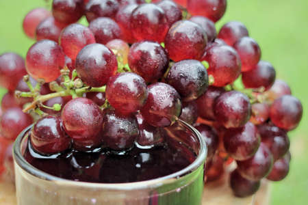 fresh grapes on a wooden backgroundの写真素材