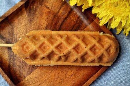 Waffle hotdog on wooden  platesの写真素材