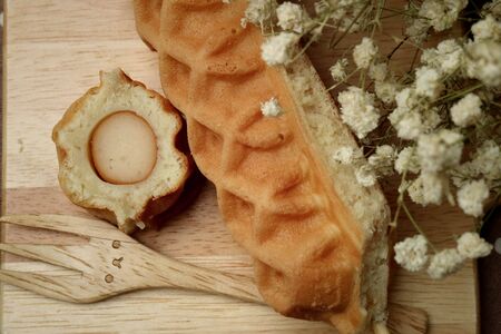Waffle hotdog on wooden  platesの写真素材