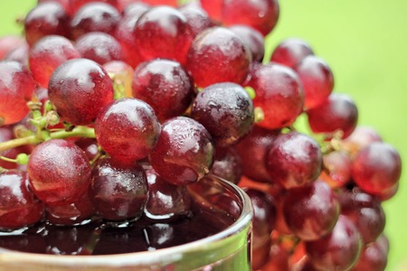 fresh grapes on a wooden backgroundの写真素材