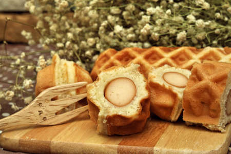 Waffle hotdog on wooden  platesの写真素材