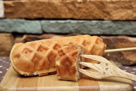 Waffle hotdog on wooden  platesの写真素材