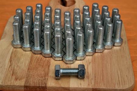 nut arrange as a heart on wood backgroundの写真素材