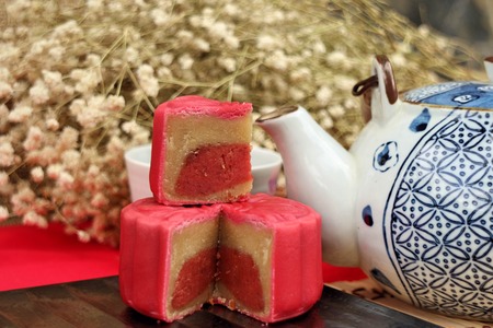 Traditional mooncakes and tea on table with teacup, Retro vintage style Chinese mid autumn festival foodsの写真素材