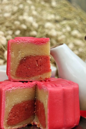 Traditional mooncakes and tea on table with teacup, Retro vintage style Chinese mid autumn festival foodsの写真素材