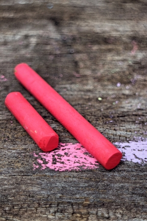 Colored Chalk on old wood backgroundの写真素材