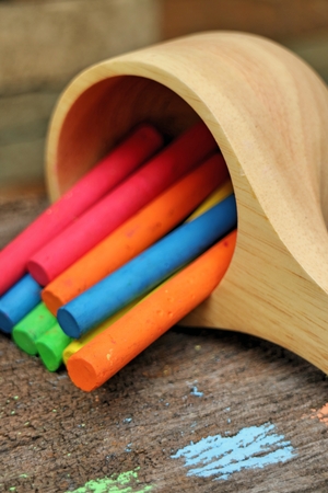 Colored Chalk on old wood backgroundの写真素材