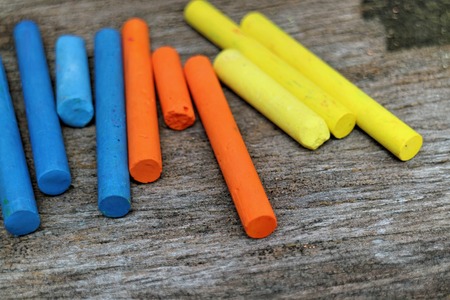 Colored Chalk on old wood background