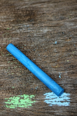 Colored Chalk on old wood backgroundの写真素材