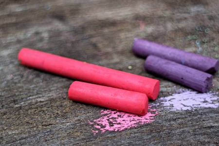 Colored Chalk on old wood backgroundの写真素材