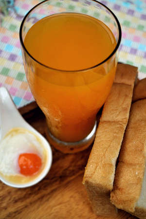 Breakfast with poached eggs and orange juice