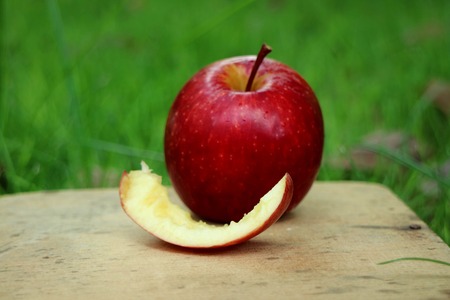 Fresh apples on wooden backgroundの写真素材