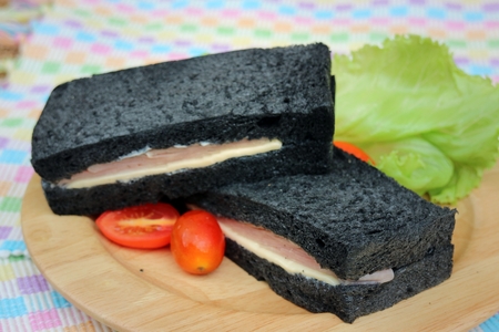 Black Bread Sandwich on Wooden platesの写真素材