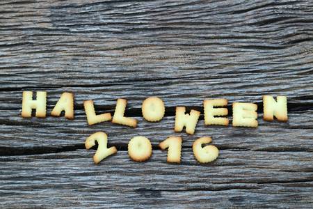 Halloween message design on wooden background