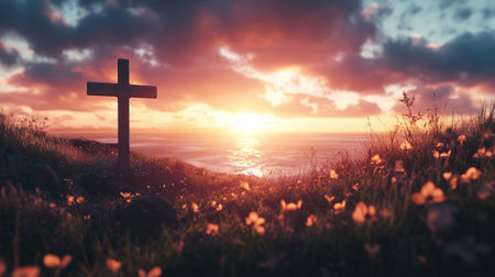 A cross in front of a beautiful sunset, representing the sacrifice and resurrection of Jesusの素材