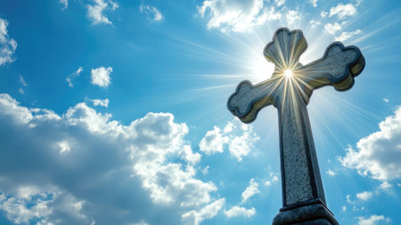 Cross with angelic rays in a bright sky, ideal for uplifting and comforting messagesの素材