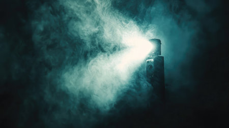A captivating vintage projector emits brilliant light beams through swirling fog, creating a mysterious and enchanting ambiance perfect for cinematic storytelling.の素材