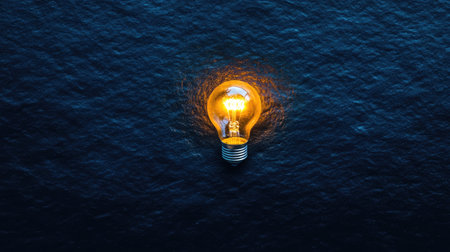 A bright light bulb floats on dark blue water, creating a serene and captivating scene that symbolizes innovation and creativity in a tranquil environment.の素材