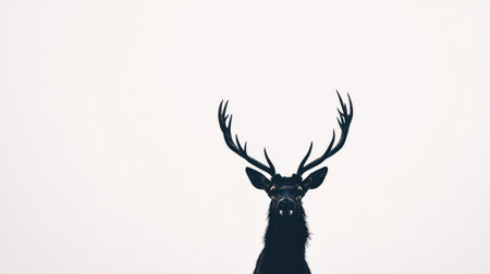 Black silhouette of a deer with antlers raised high, set against a bright white background, creating a simple and powerful contrast.の素材