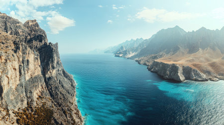 Panoramic shot of the dramatic cliffs along the coast of Socotra Island, showcasing the rugged terrain and vast ocean views. No people included.の素材