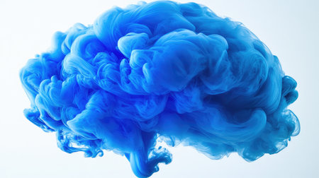 Blue ink drop dispersing in clear water, creating beautiful swirls.の素材