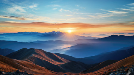 A serene sunrise over a remote mountain range, beckoning adventurers to a peaceful and scenic travel destination.の素材