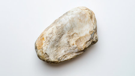 A flat lay of a smooth white stone centered on a plain white background, offering a sense of tranquility.の素材
