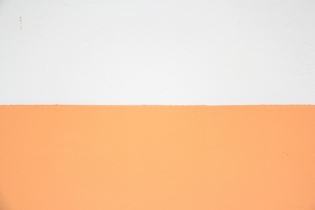 Orange and white wall concrete  background,Two colorsの写真素材