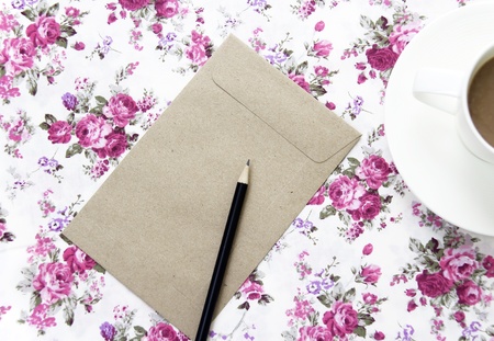 Blank envelopes on the table with pencil and coffee cup