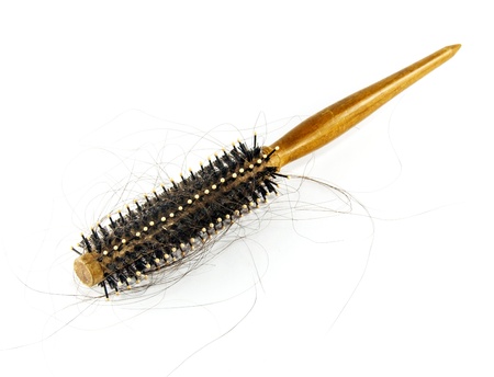 round hair brush with lost hair, isolated on whiteの写真素材