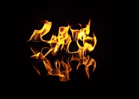 Fire flames on a black backgroundの写真素材