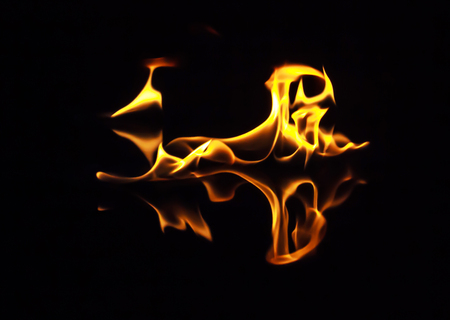 Fire flames on a black backgroundの写真素材
