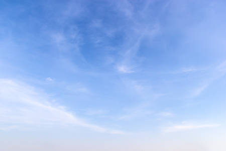 Fantastic soft white clouds against blue skyの写真素材