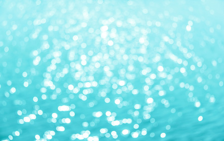 Abstract circular bokeh background of Light shining on the river, Abstract river shot in manual mode out of focus  Blue color の写真素材