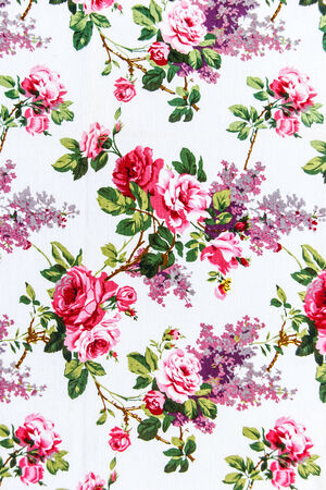 Red rose fabric background, Fragment of colorful retro tapestry textile pattern with floral ornament useful as background の写真素材