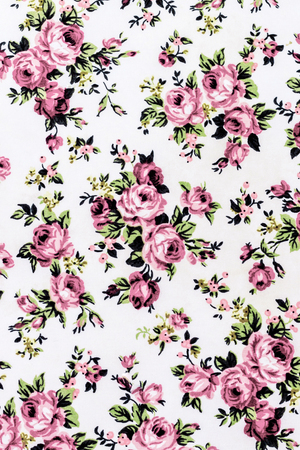 Pink rose fabric background, Fragment of colorful retro tapestry textile pattern with floral ornament useful as background の写真素材