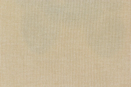 light yellow knitted  fabric texture or background.の写真素材