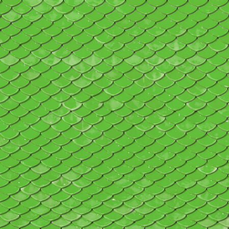 Old roof tiles made of terracotta as backgroundの写真素材