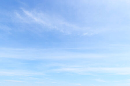 Fantastic soft white clouds against blue skyの写真素材