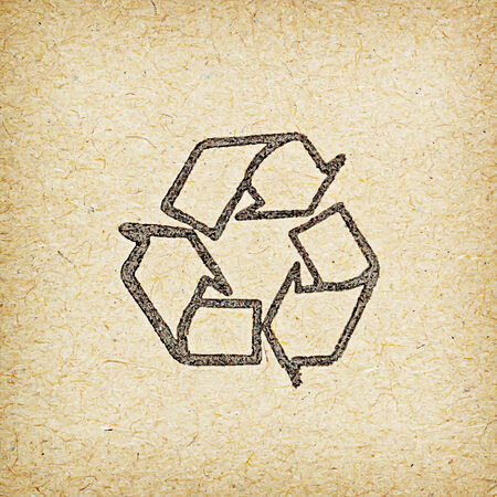 recycle logo on recycled paper background.の写真素材