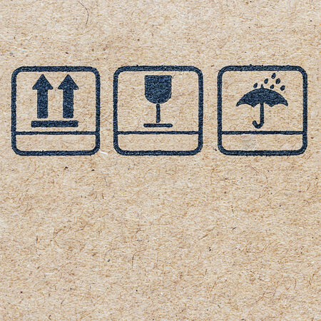 symbols on Cardboard ,  logo on recycled paper background.の写真素材