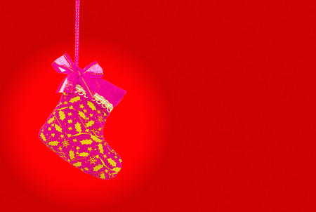 Christmas sock on red  の写真素材