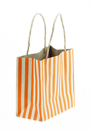 Brown paper bag orange stripes isolated on white.の写真素材