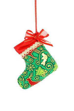 Christmas sock hanging over white background.の写真素材
