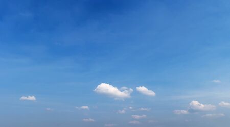 Fantastic soft white clouds against blue skyの写真素材