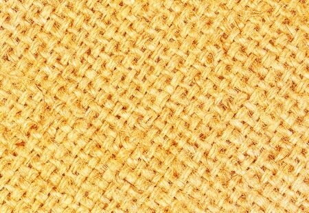 golden sackcloth textured for background.の写真素材