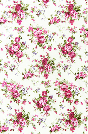 pink rose vintage on fabric background.の写真素材
