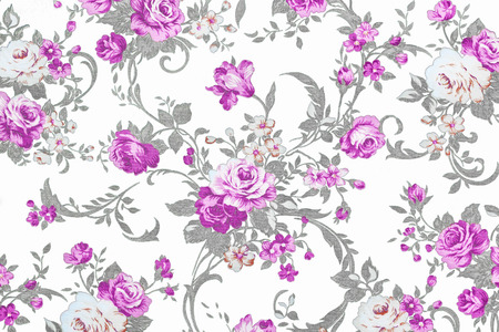 purple rose on white fabric background, Fragment of colorful retro tapestry textile pattern with floral ornament useful as background.の写真素材