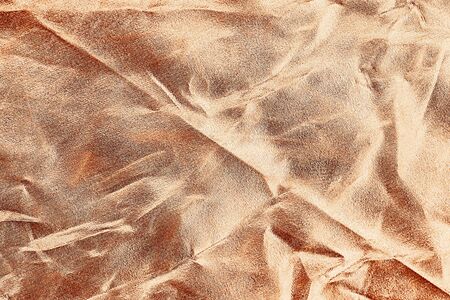 Rose gold color as background or texture and shadow. Rose gold fabric crease. Pink gold background