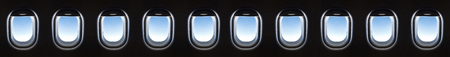 airplane window 10 and Fantastic soft white clouds against blue sky.の写真素材